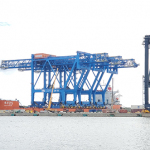 Cranes on Ship at Wharf